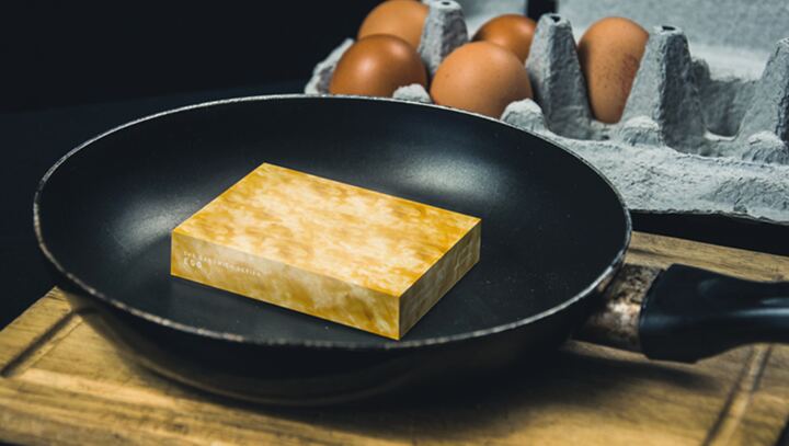 The Sandwich Series Egg deck: a yellow, egg-textured box sitting in a frying pan beside a carton of eggs.